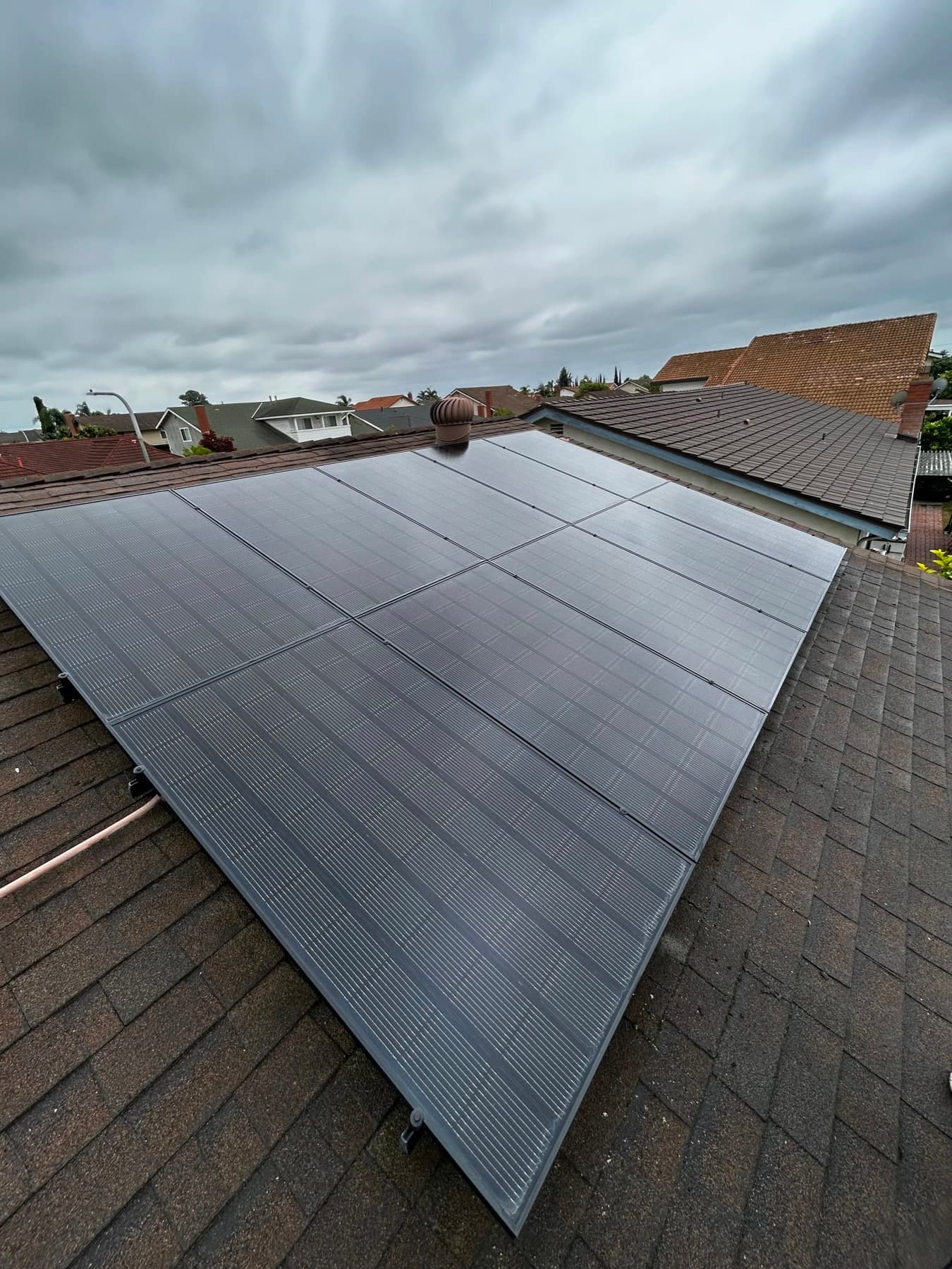 Cleaned solar array under a marine layer sky in Orange County